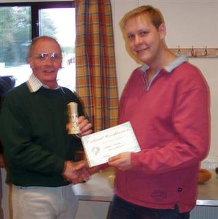 The monthly winner Howard Overton received his certificate from Simon Hope